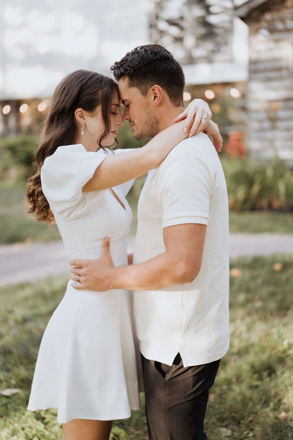 Bride and groom embrace during intimate wedding portraits, engagement photos before surprise wedding in Moncton wedding photography NB
