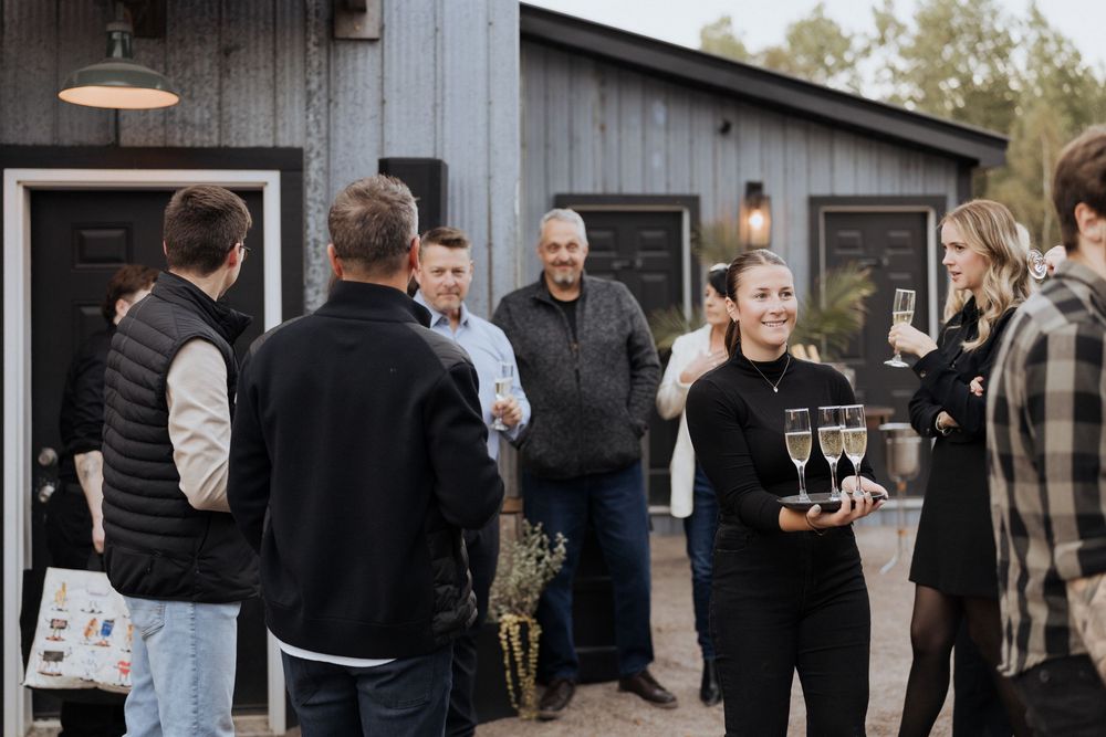 Guests are served champagne welcome during during engagement party turned surprise wedding, elopement photography Moncton New Brunswick