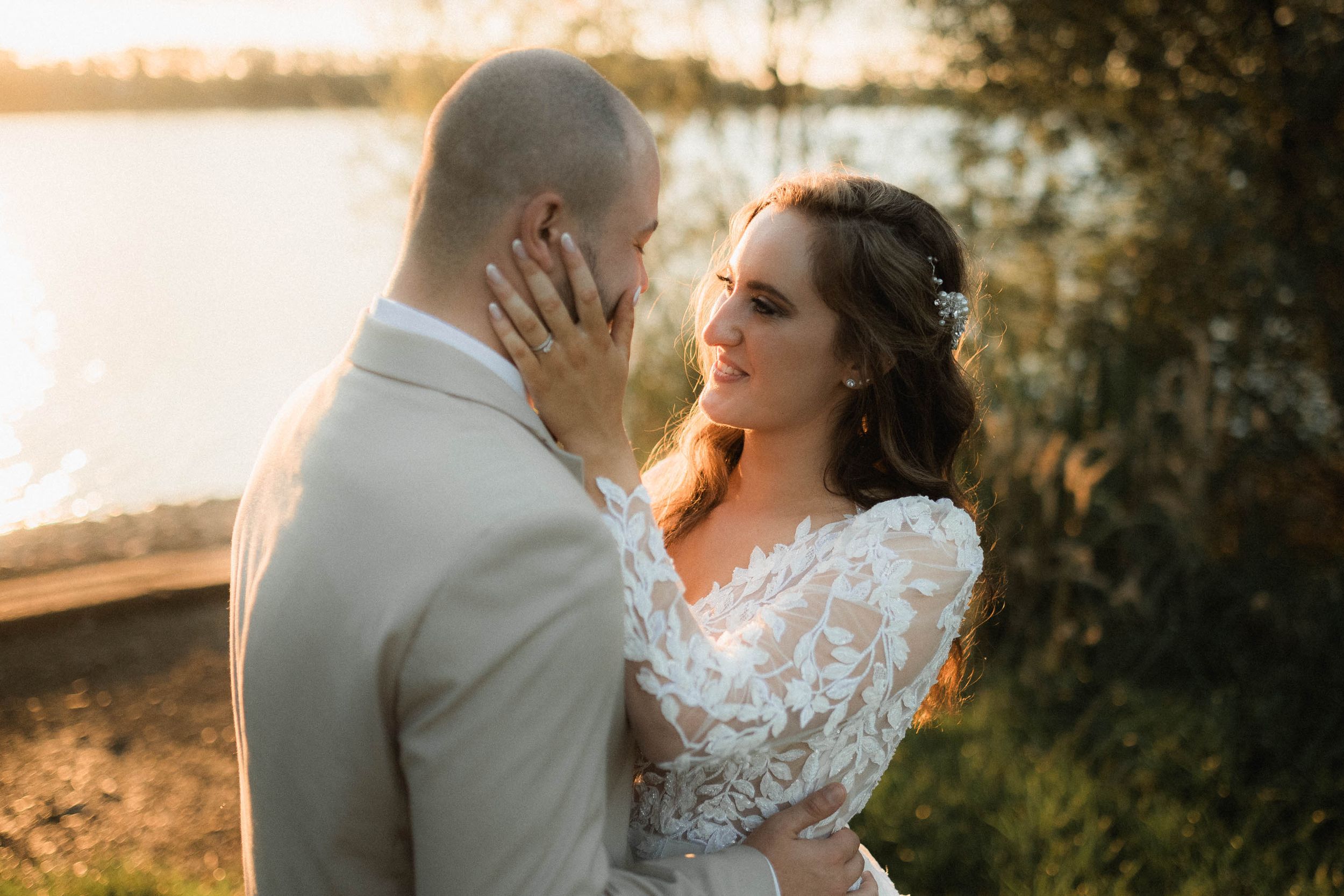 Romantic sunset wedding photography with couple in elegant attire.