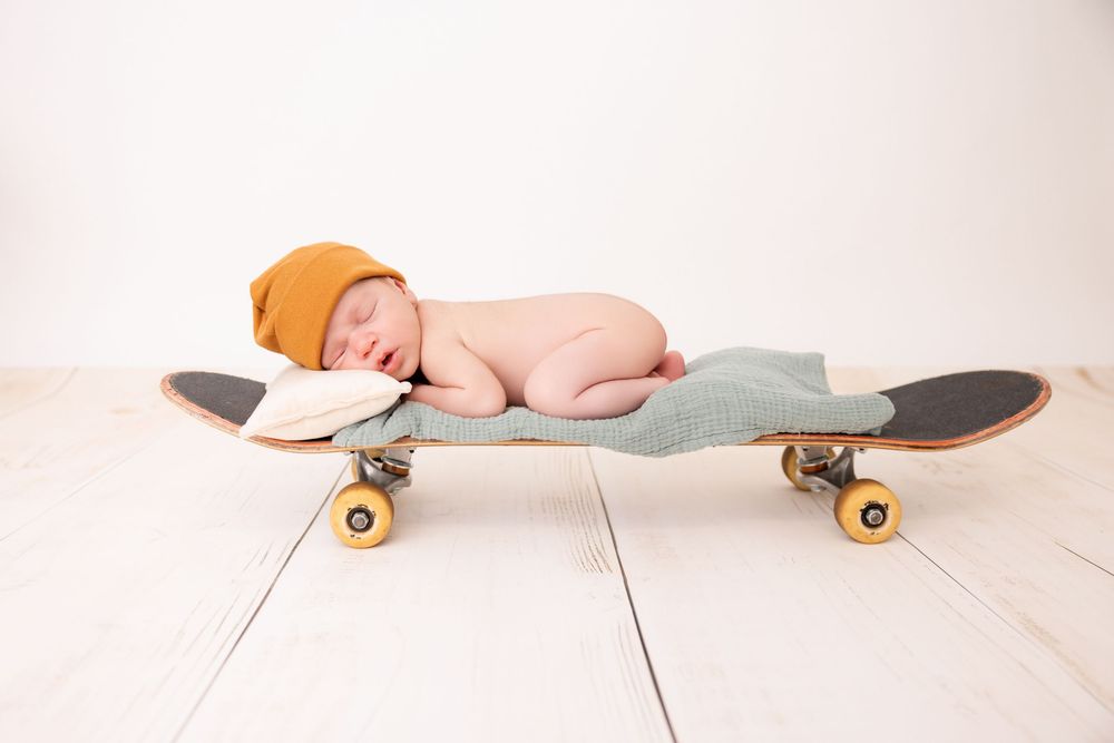 best Long Island newborn photographer, best Nassau county newborn photographer, newborn skateboard photo shoot, newborn skateboard theme
