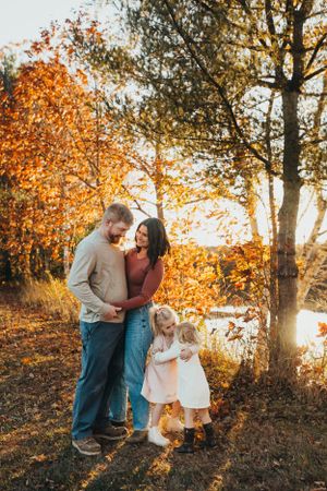 Heartwarming family photo sequence captured during golden hour with fall colors in the background.