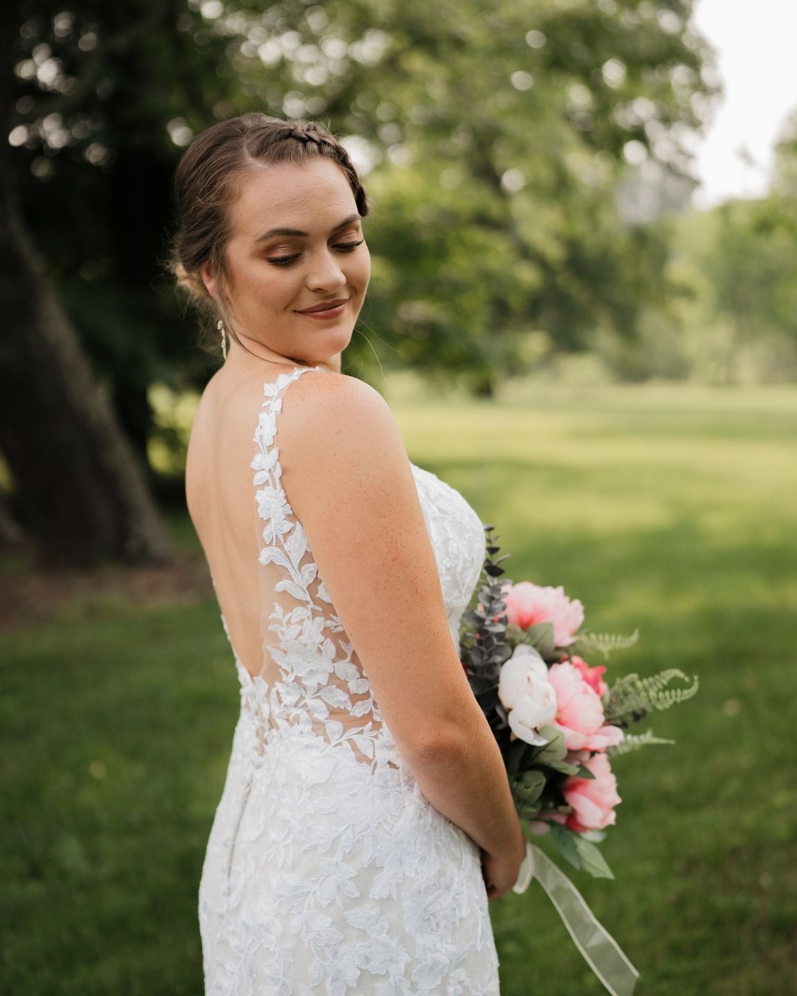 A wedding dress with intricate lace detail and an elegant back design.