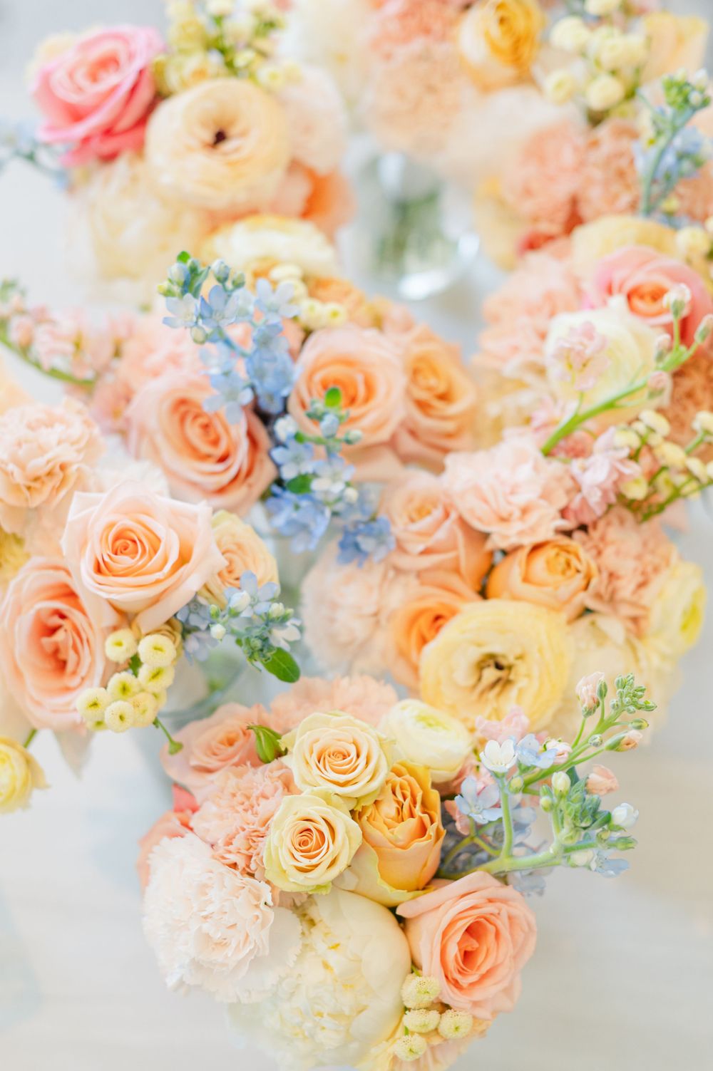 An array of beautiful pastel bouquets for bridesmaids and brides for a wedding at Parish of Christ the King in Tulsa, Oklahoma.