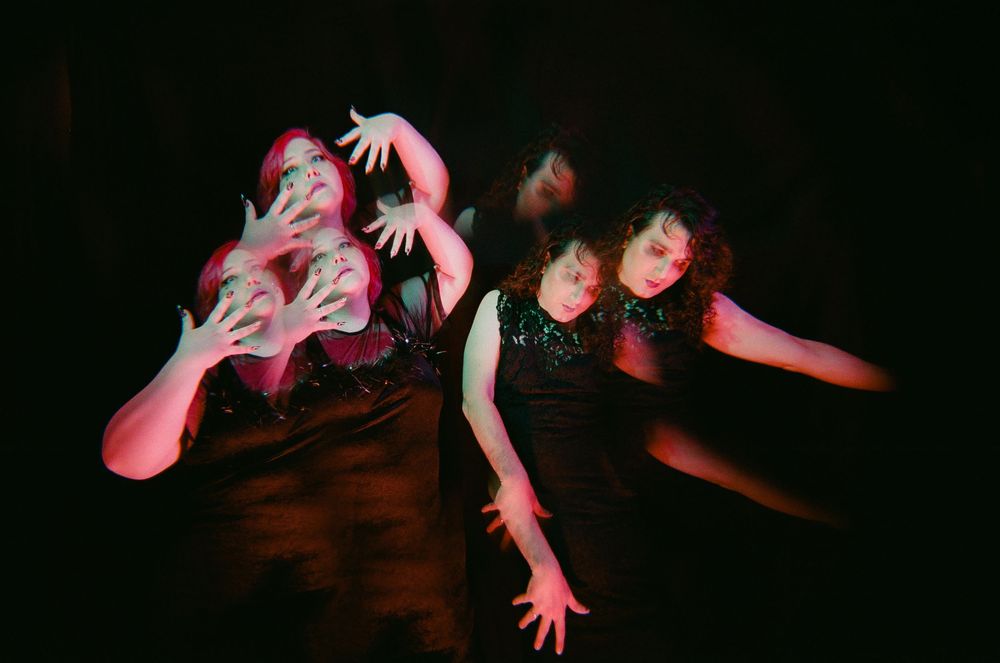 Abstract artistic photo with multiple exposure effects and reaching hands.