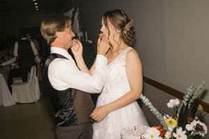 An emotional moment shared between newlyweds during their wedding reception.