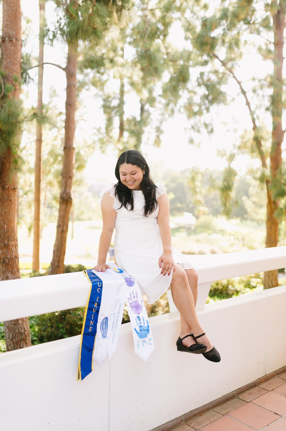 University of California Irvine grad portrait taken outdoors on campus