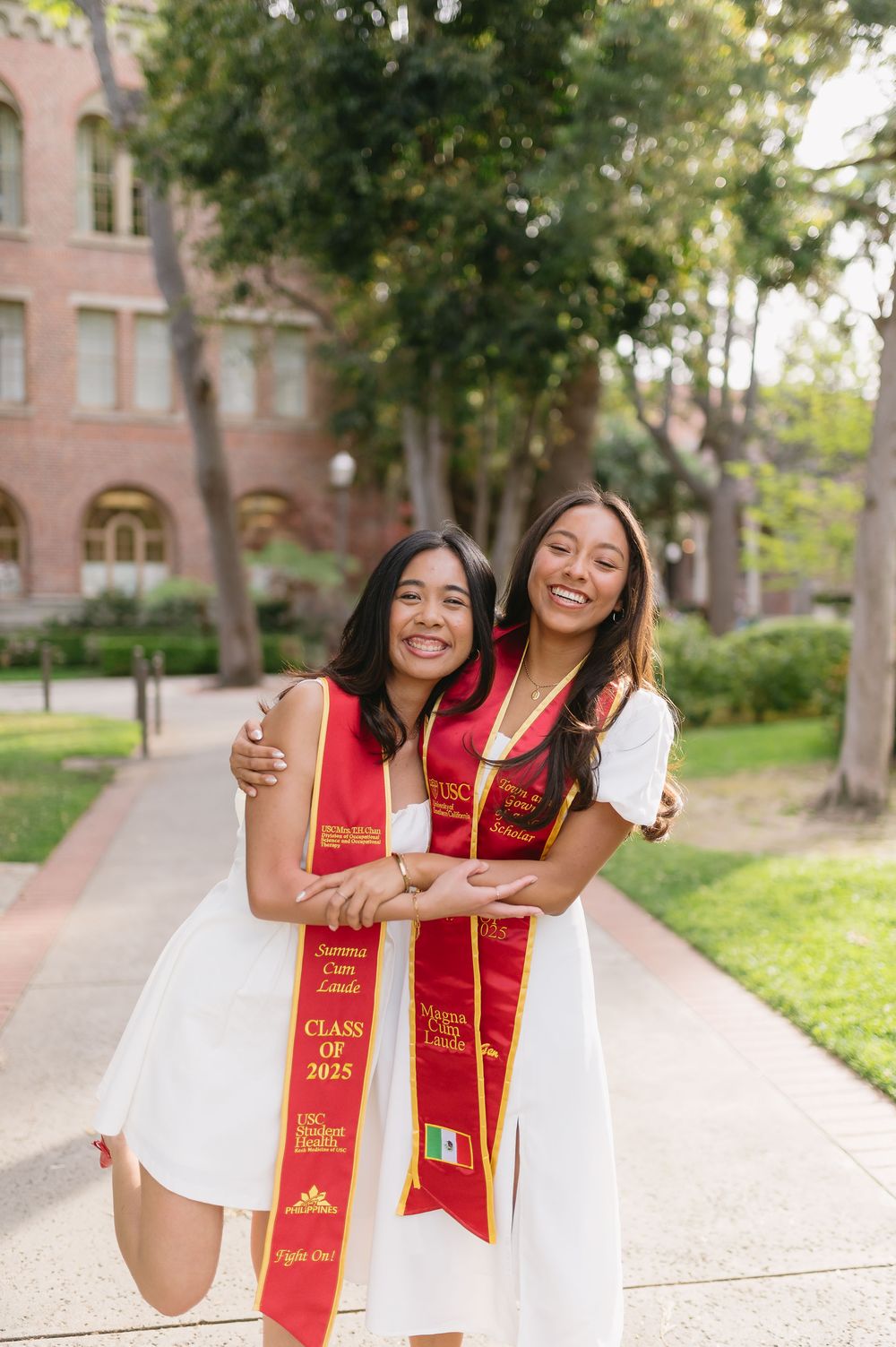 University of Southern California women graduates celebrating graduation together at USC campus