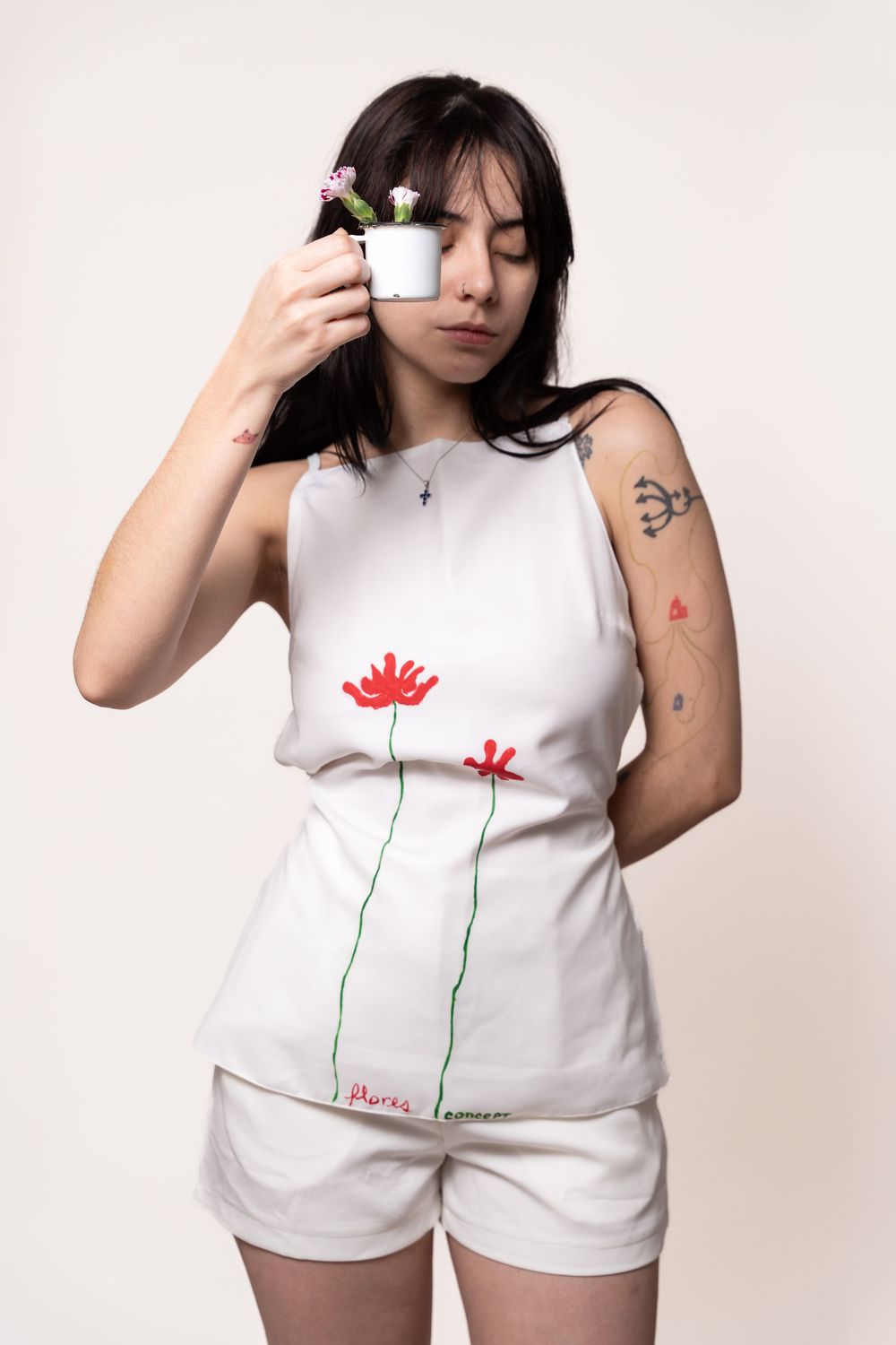 Editorial fashion portrait showcasing hand-painted garments with minimalist styling, artistic details, and expressive visual storytelling.