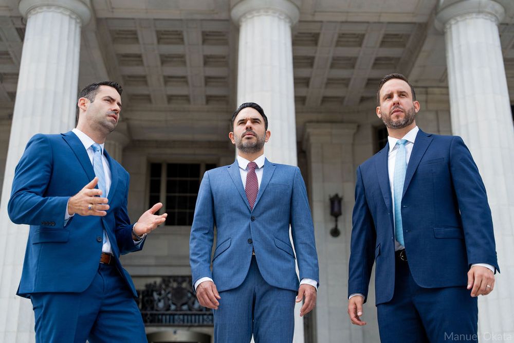 Professional legal team portrait outside the Miami-Dade Courthouse, emphasizing trust, leadership, and collaboration.