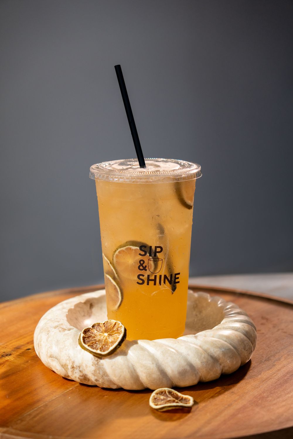 Refreshing citrus drink photographed for Sip & Shine, highlighting freshness, branding, and premium beverage presentation.