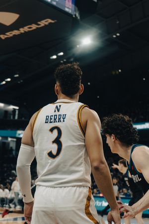 Basketball player wearing jersey number 3 with 'Berry' on back faces opponent during professional game.