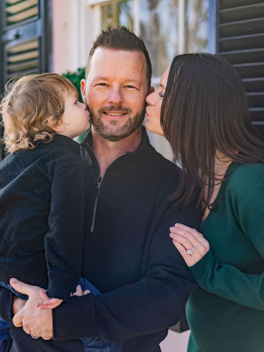 A series of candid photos showing people embracing and sharing warm hugs outdoors.