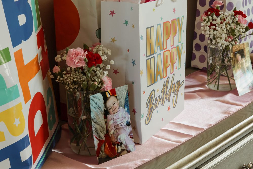 Colorful birthday party wall decorations with festive lettering and balloons.