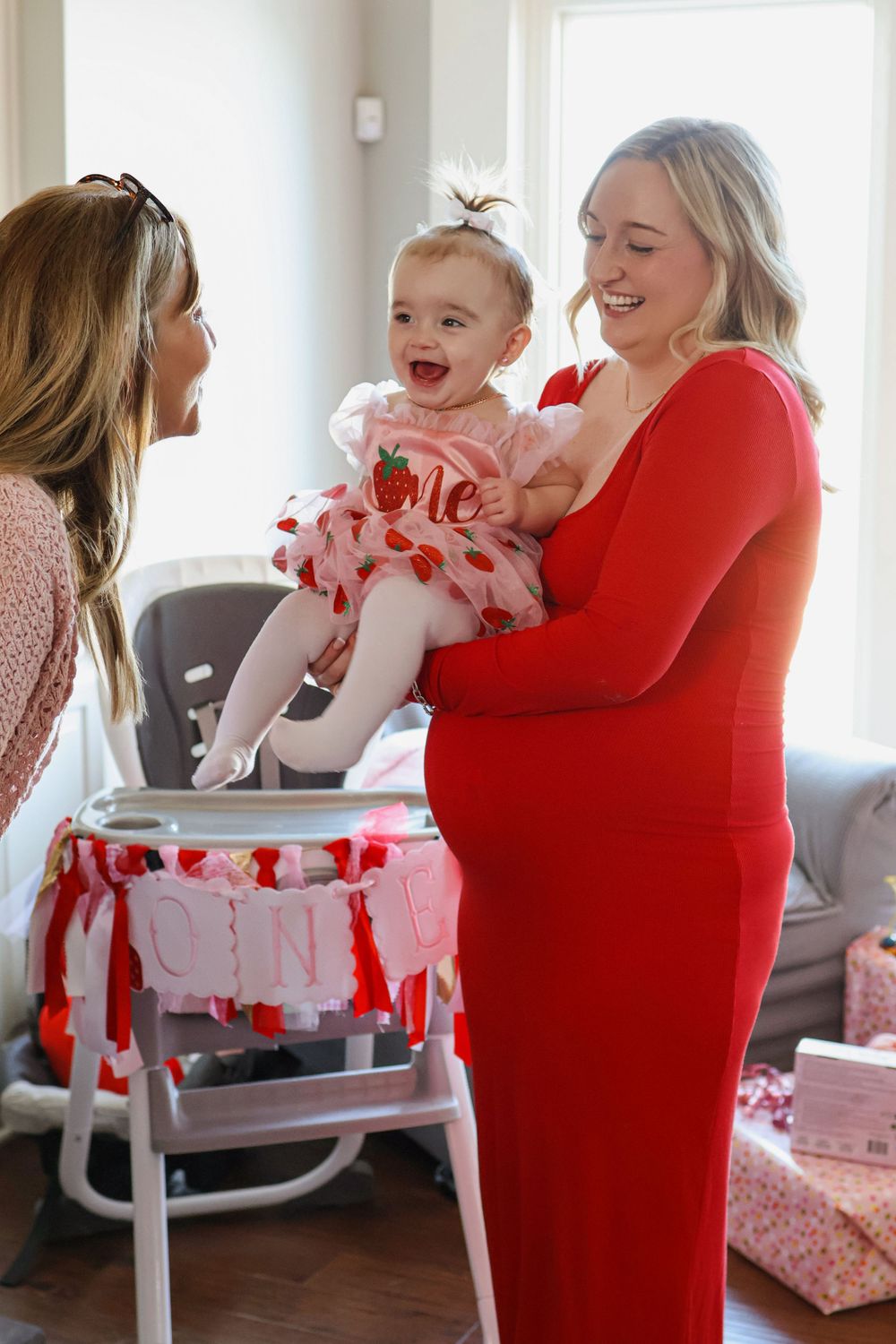 A bright red and white themed celebration with balloons and decorative elements.