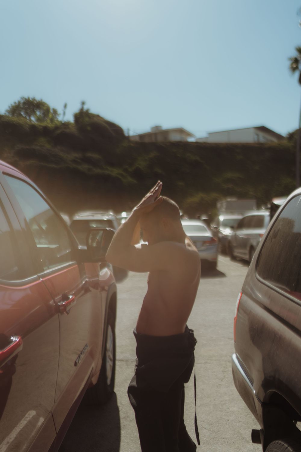 a man applying sunscreen on his head