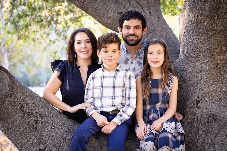 San Jose family on bed with dog during newborn photo session with Bay Area Newborn Photographer Cindy Tucey Photography