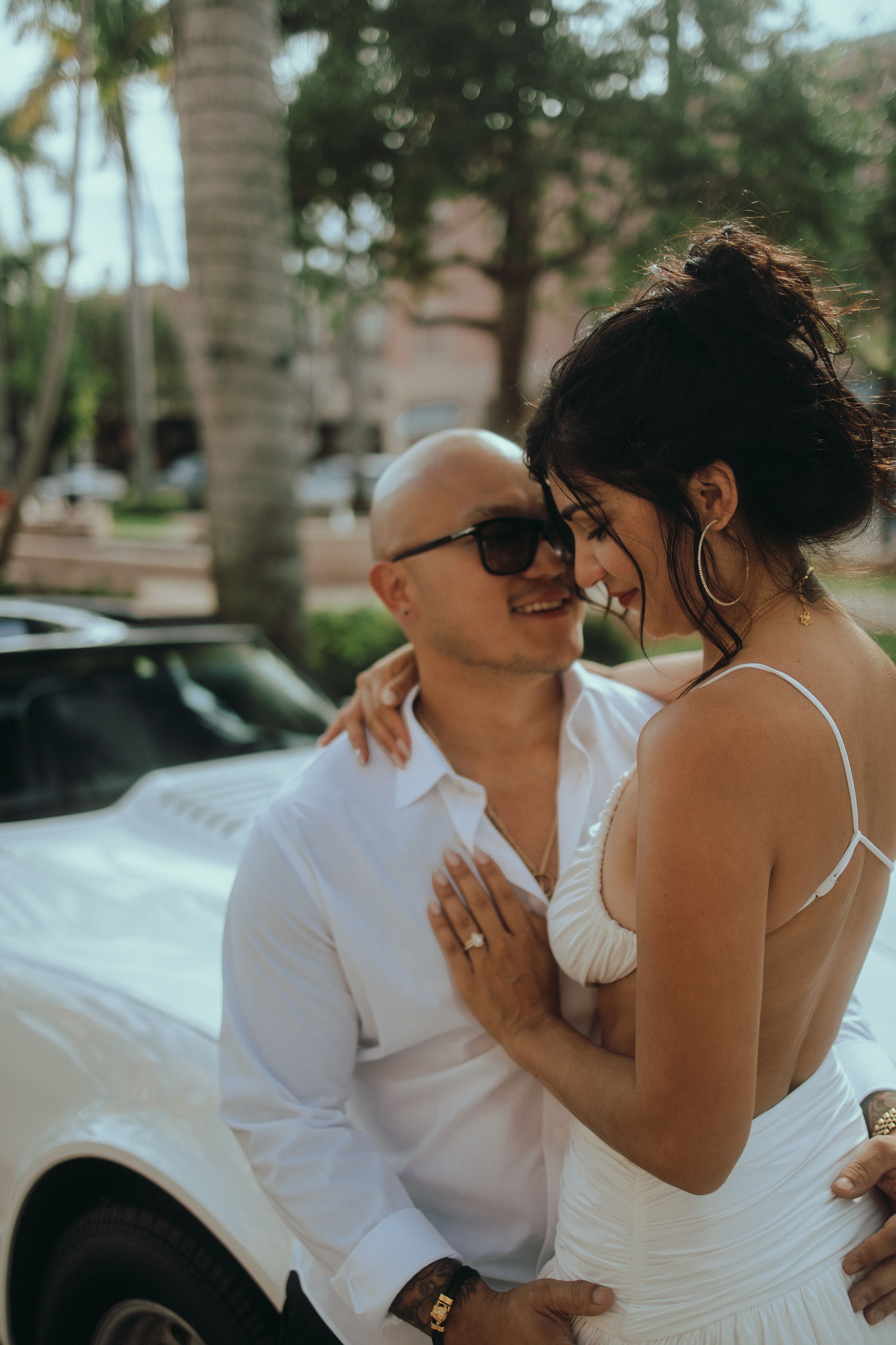 Romantic Miami engagement style photoshoot featuring elegant couple photography and luxury car moments