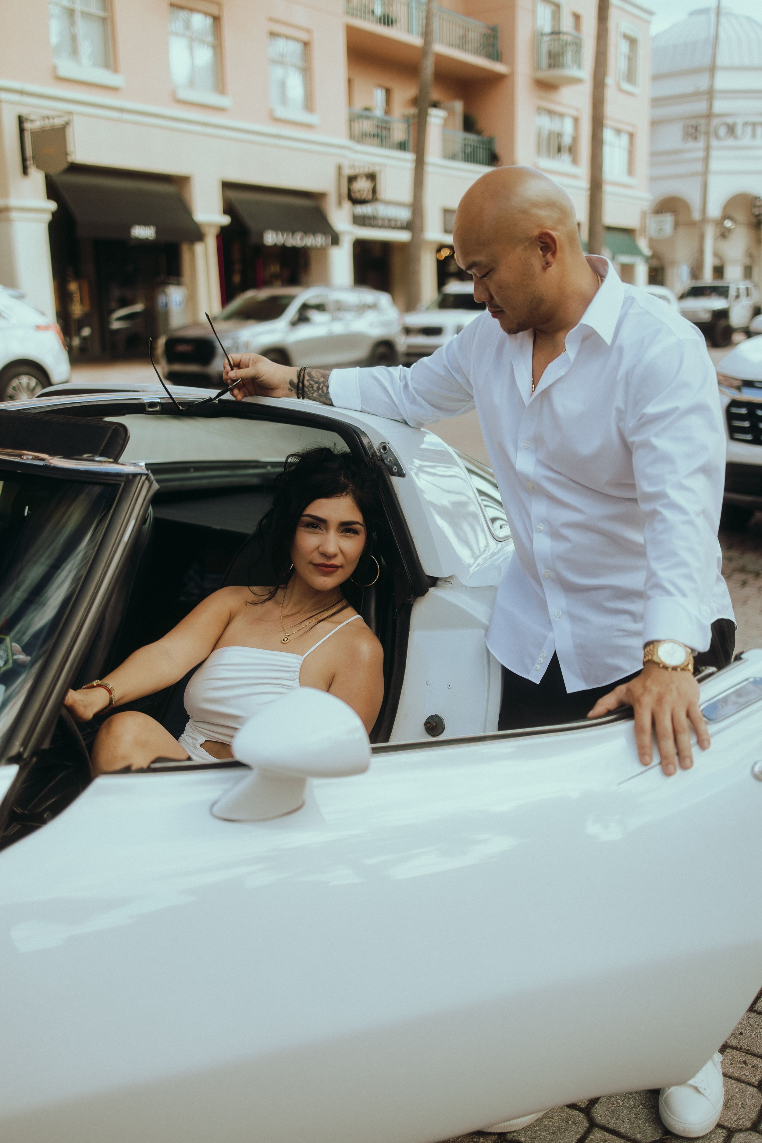 Luxury couple portrait session in South Florida with cinematic white convertible aesthetic by MannyPortraits