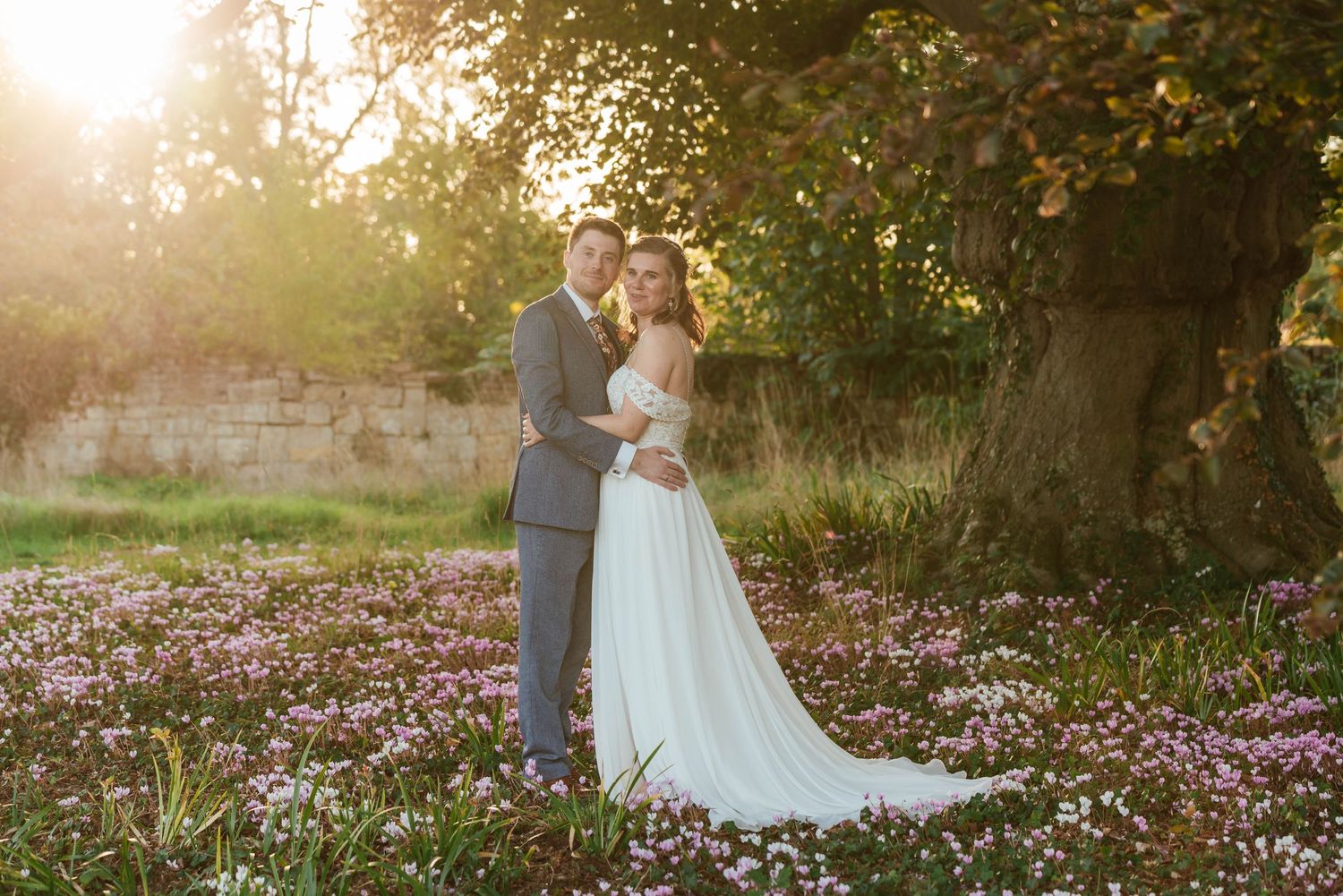 Cotswolds Wedding Photographer Zara Davis Photography Gloucestershire Elmore Court Couple in the flowers at sunset