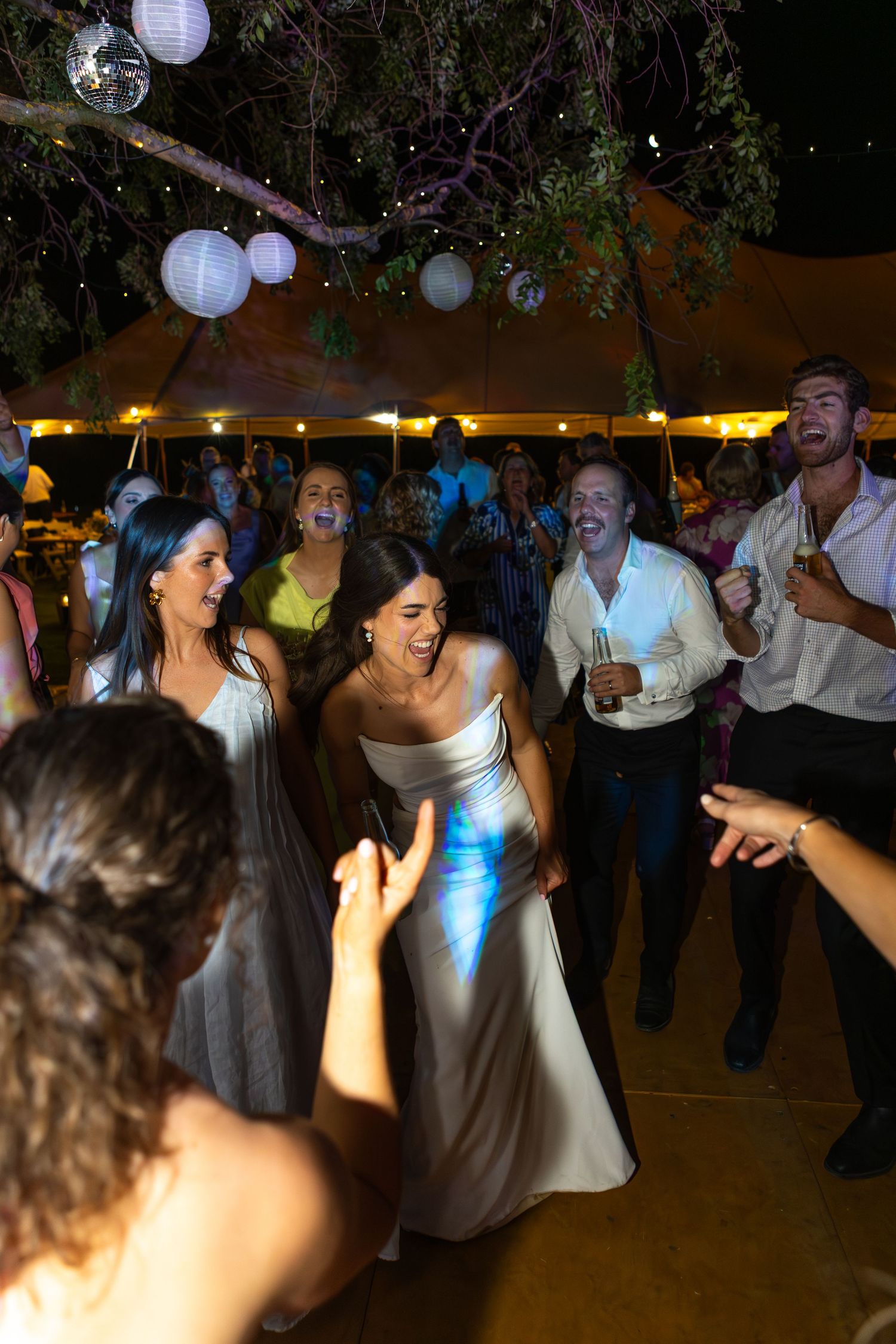 people dancing on dance floor at country wedding