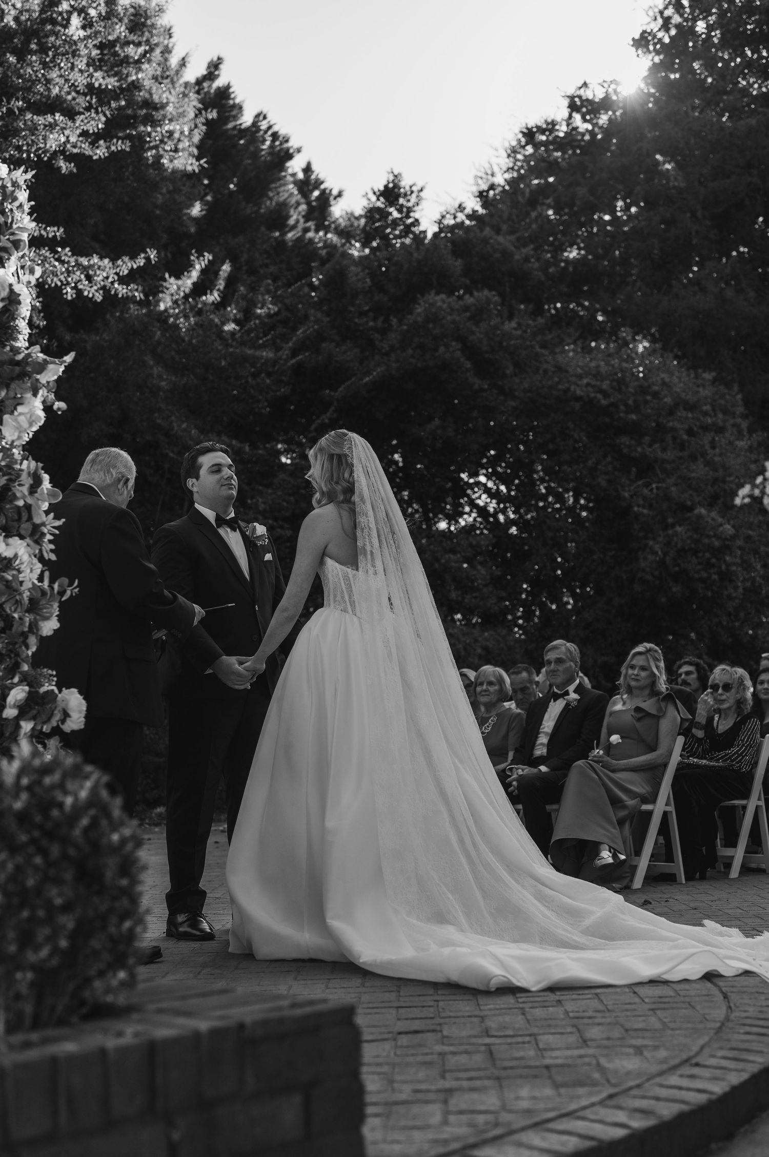 A series of romantic wedding photos showing a couple in formal attire sharing intimate moments and kisses.