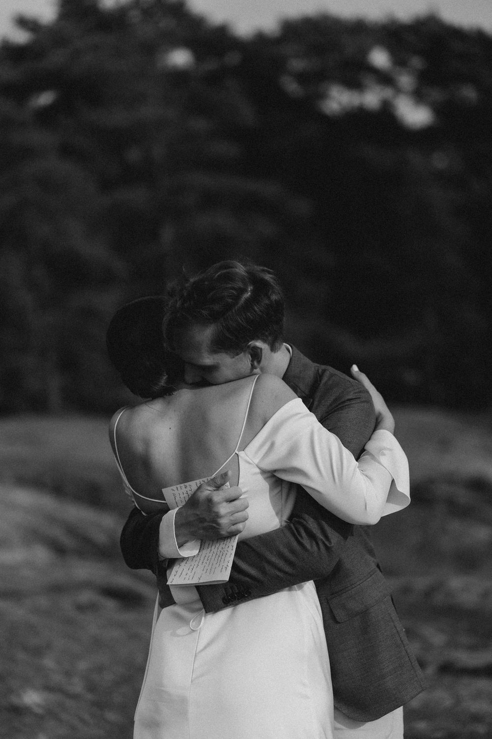 emotional outdoor hug during elopement natural documentary wedding photography in Finland