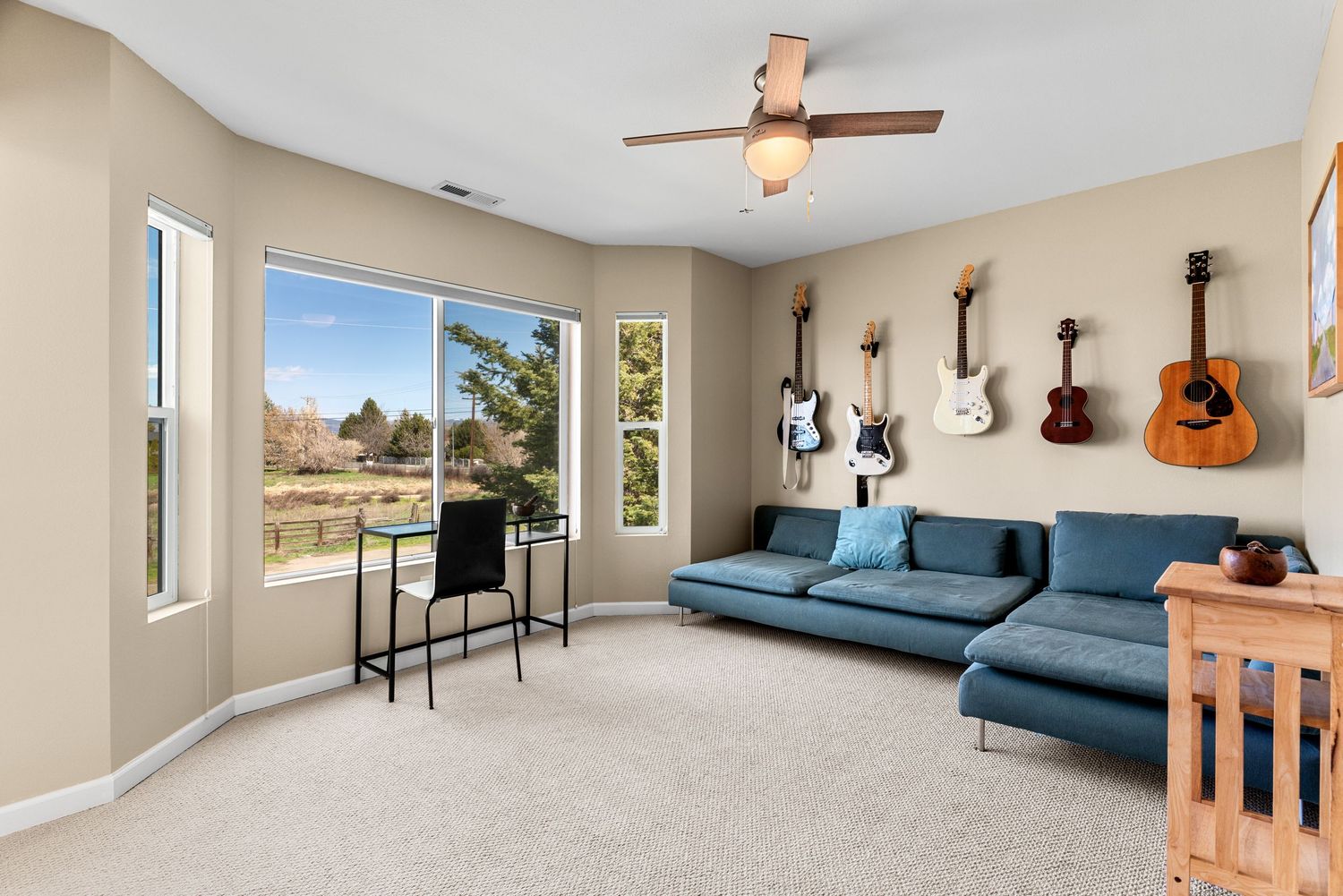 Bright modern rec room with large windows and natural light in professionally photographed home in Ellensburg, WA