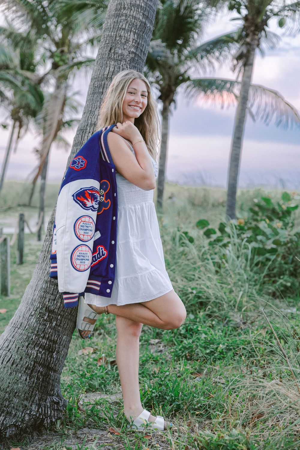 Senior Portrait with varsity jacket at pompano beach
