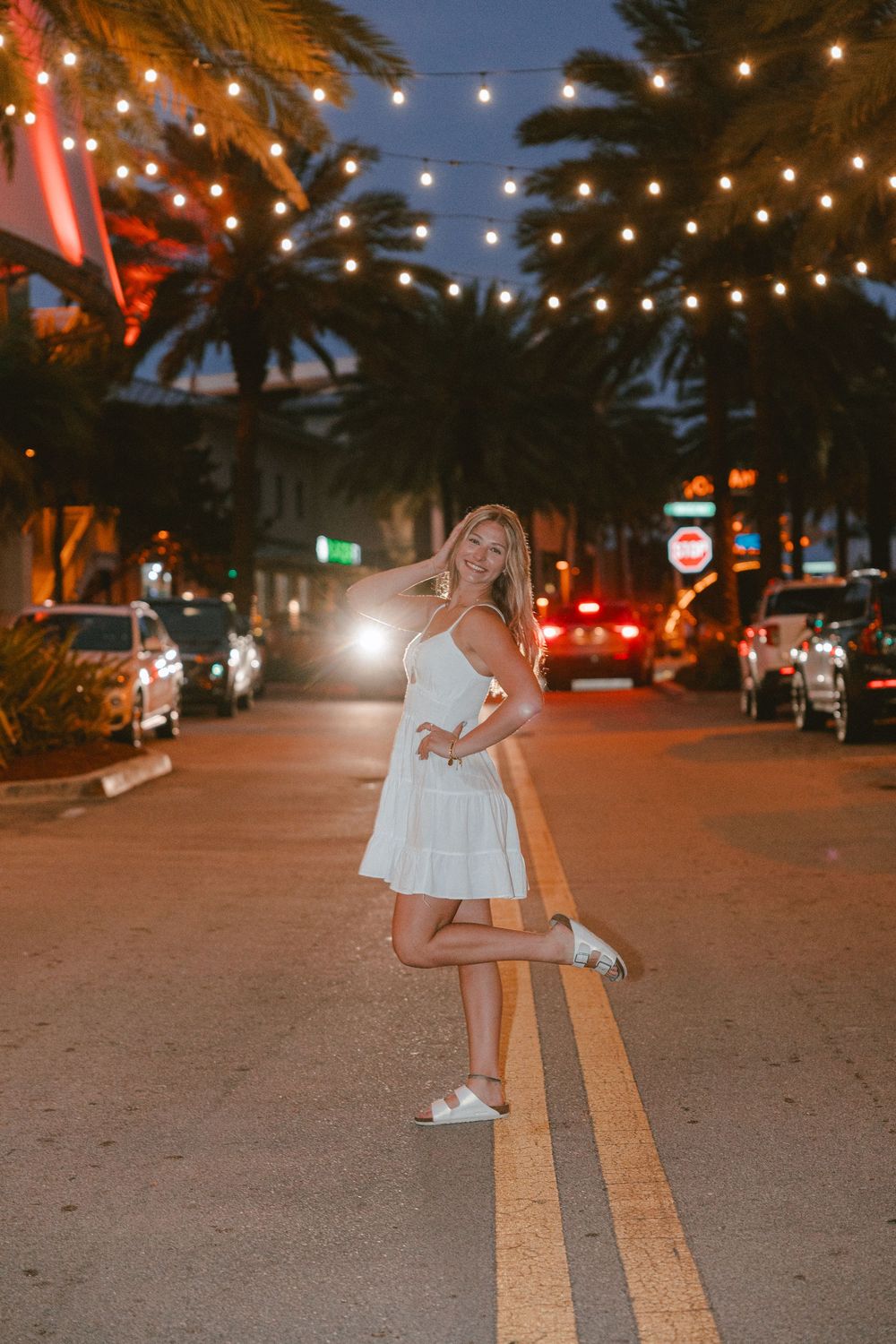 night time senior portrait with ambient lighting and Edison hangin lights in pompano beach