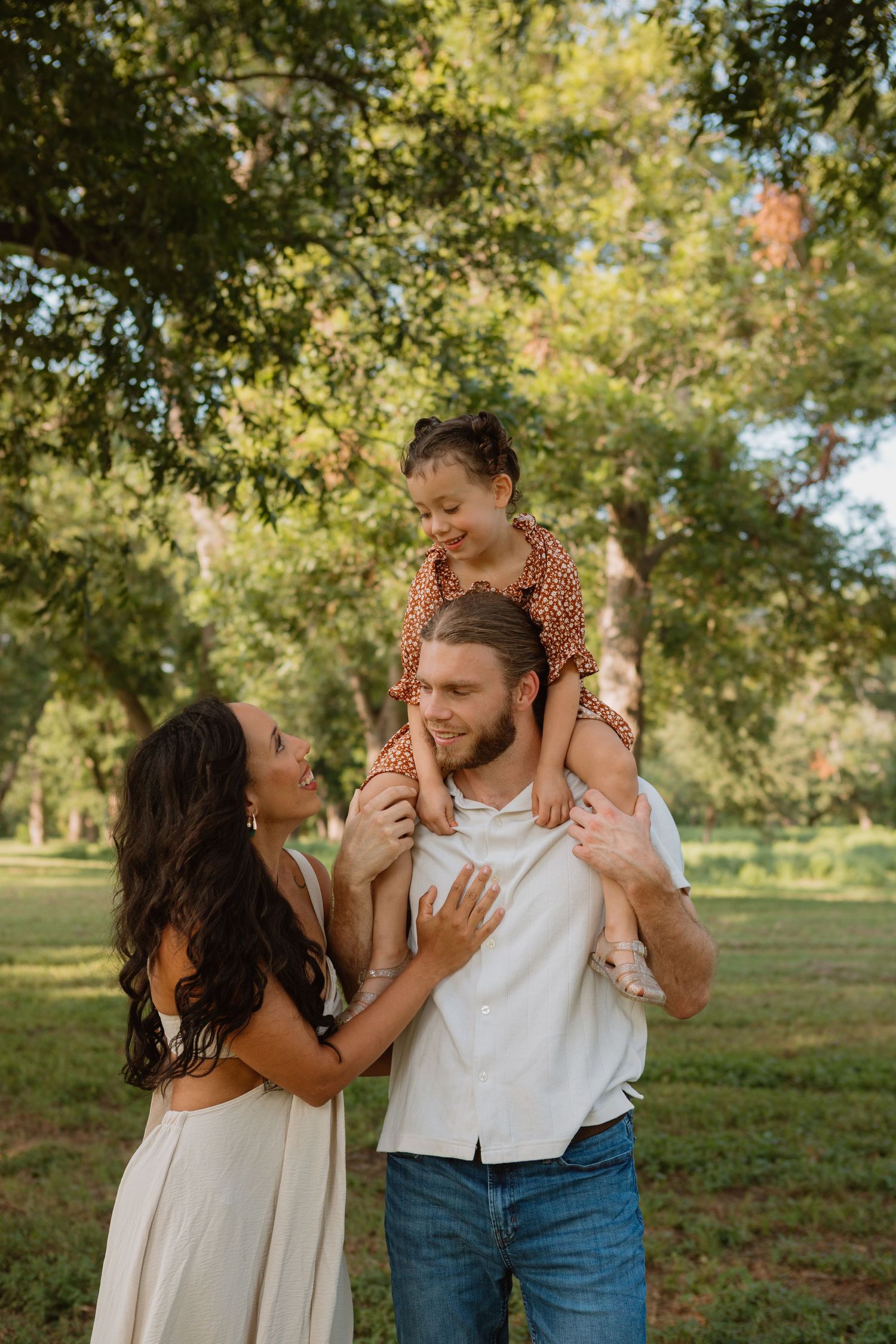 Couple under a veil during golden hour portraits from a Wedding ceremony in Central Texas