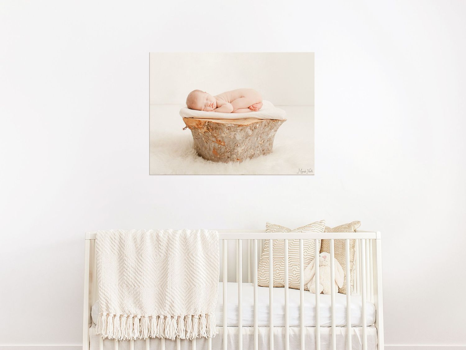 A collage of soft pastel newborn photography featuring a white crib, sleeping baby, and nursery decor.