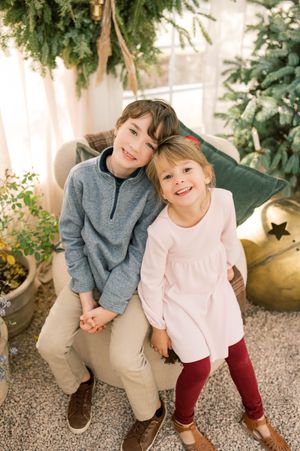 Three candid photos of young children sitting together outdoors with greenery and plants in the background.