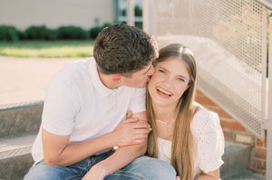 Candid engagement photo session outdoors in natural light.