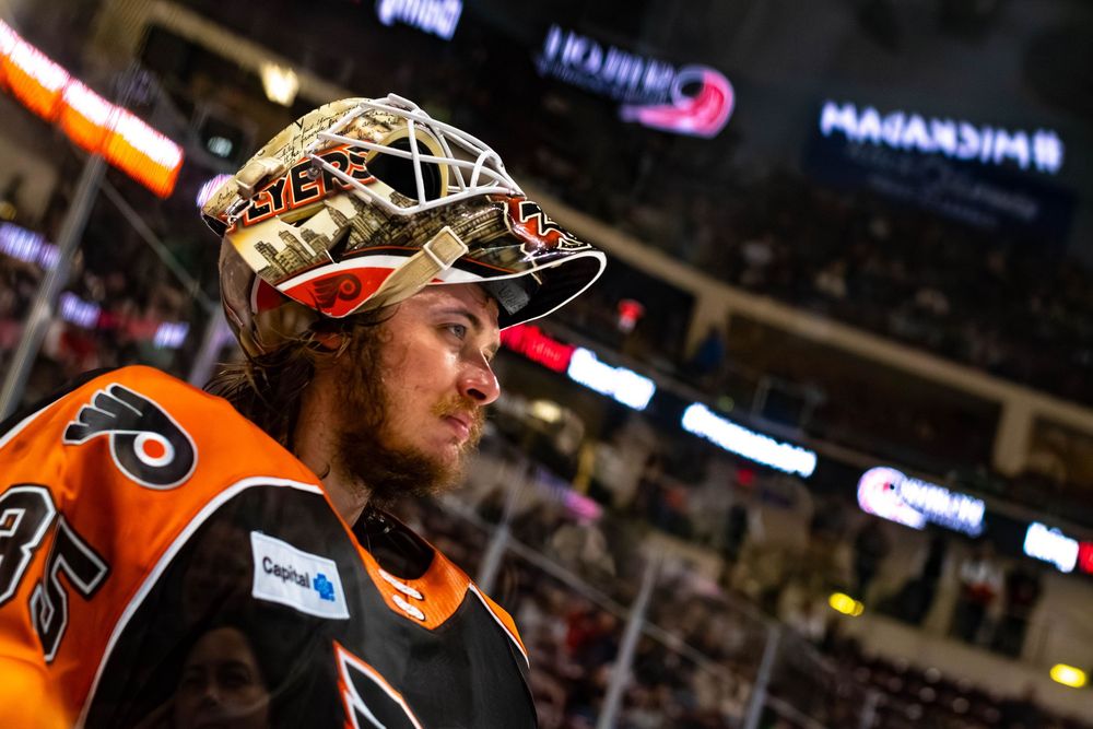 A close-up of Lehigh Valley Phantoms goalie Aleksei Kolosov with his mask raised.