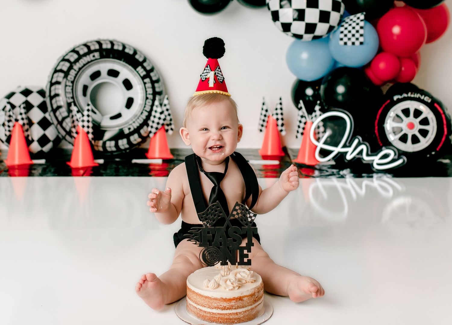 Happy baby at cake smash session jennifer kristin photography chillicothe ohio studio
