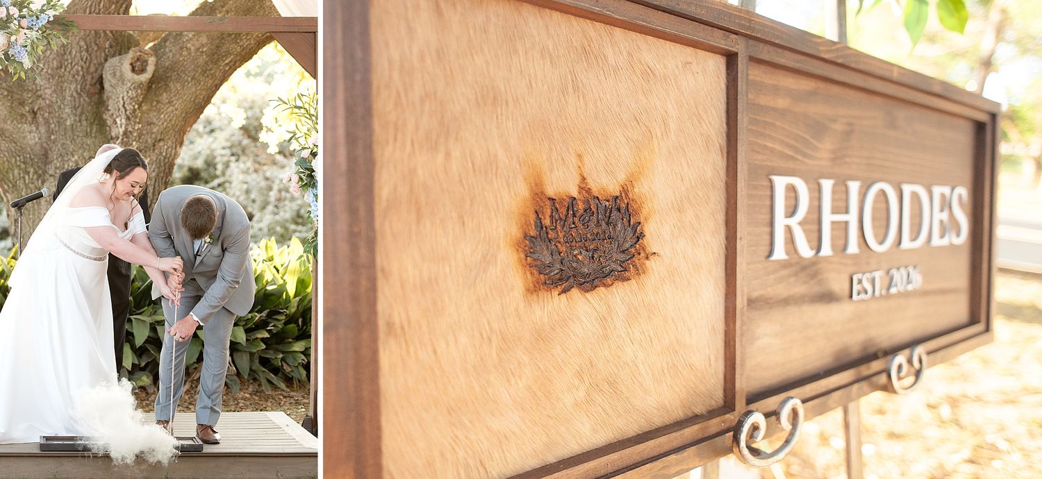 Bride and groom signing wedding documents outdoors, beside a rustic wooden Rhodes family established sign.