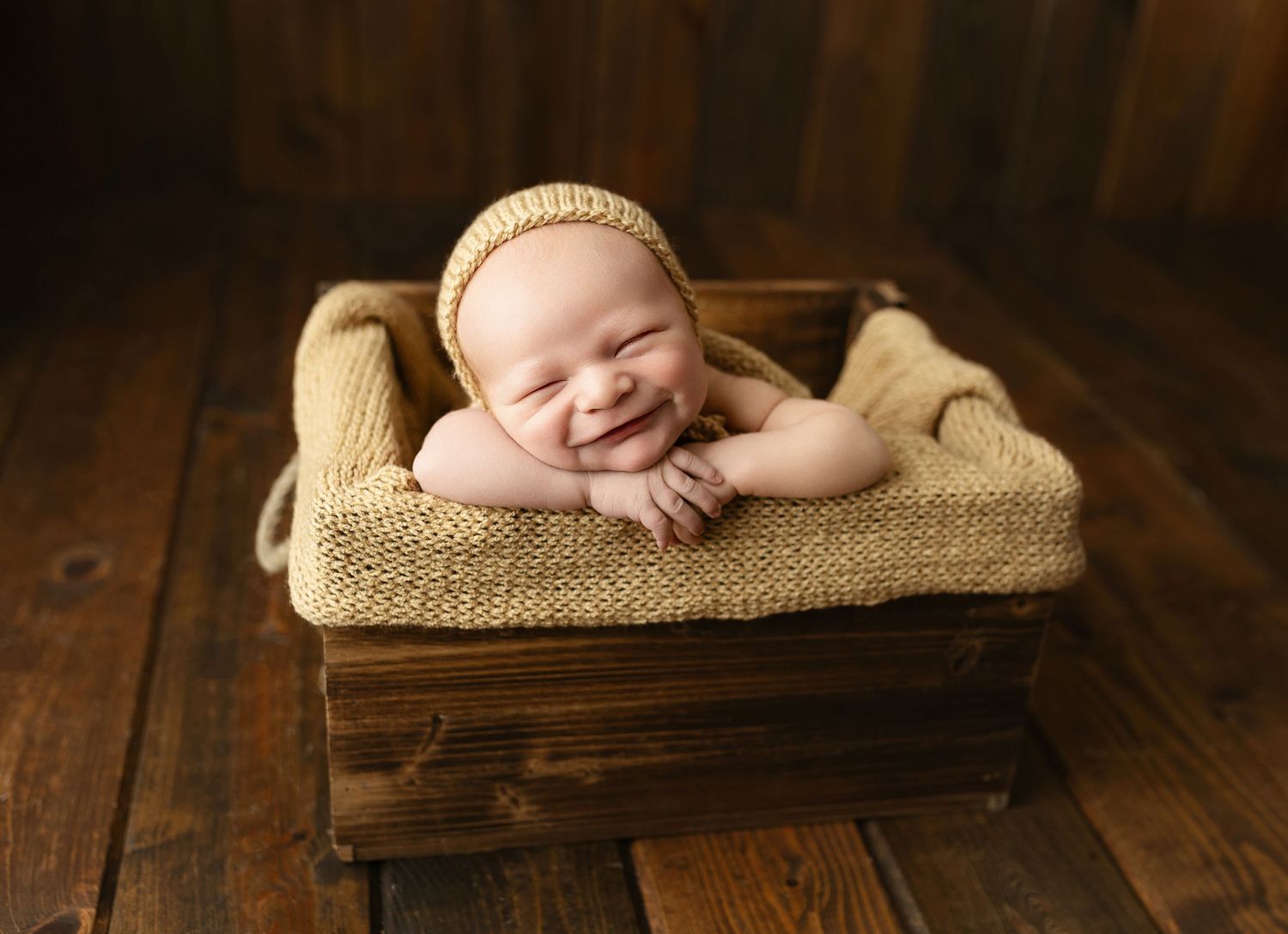 Newborn in wooden crate smiling. Greenville sc newborn photographer, Easley sc newborn photographer, Upstate newborn photographer, Greenvill