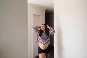 A sequence of photos showing someone in a striped shirt doing a dance or movement routine in a bright indoor space.