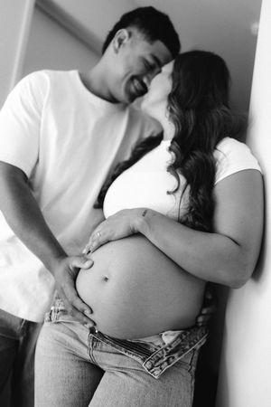 A romantic black and white photo series showing tender intimate moments between a couple.