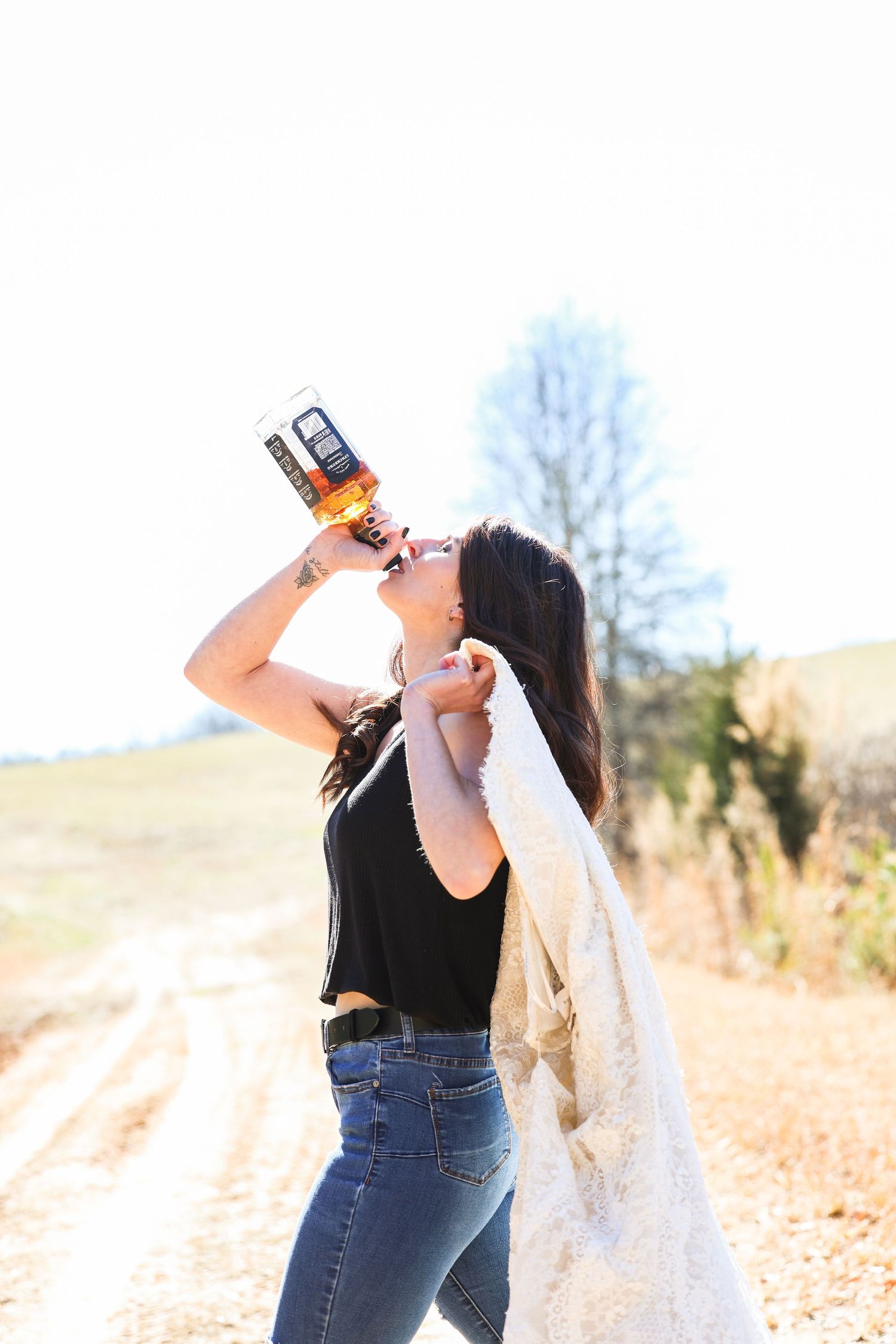 Jack Daniels whiskey and burning the dress. Getting closure.