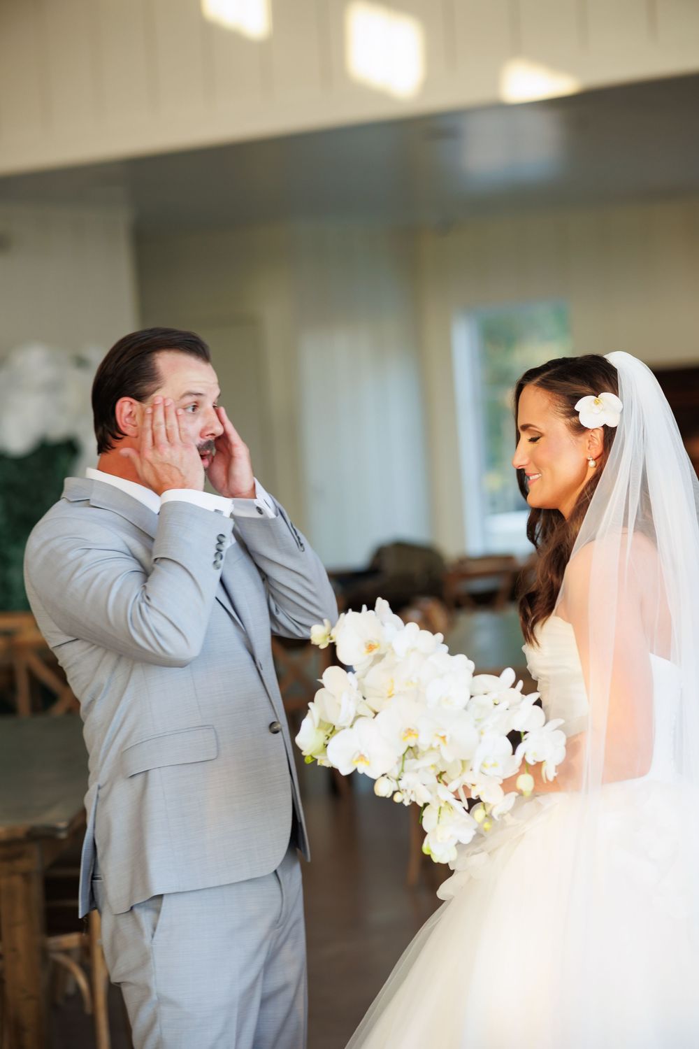 A series of emotional first look wedding photos showing a couple's reaction upon seeing each other before the ceremony.