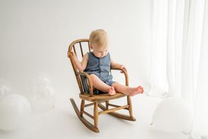 Four connected images show a rocking chair near window light with different compositions and perspectives.