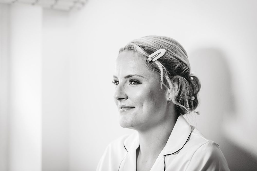 Black and white portrait of a bride getting ready on her wedding day.