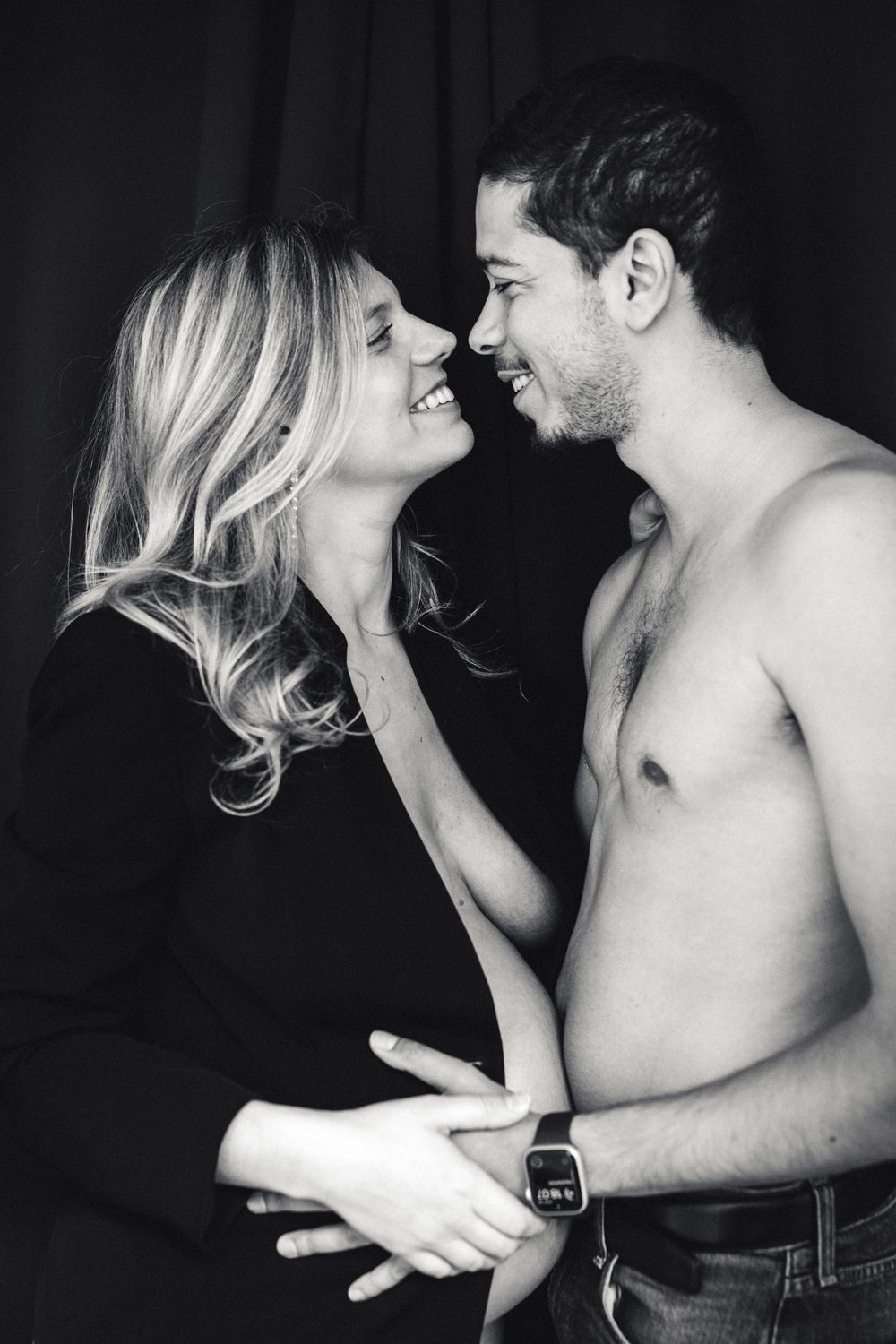 A romantic black and white photo sequence shows a couple in an intimate embrace sharing tender moments together.