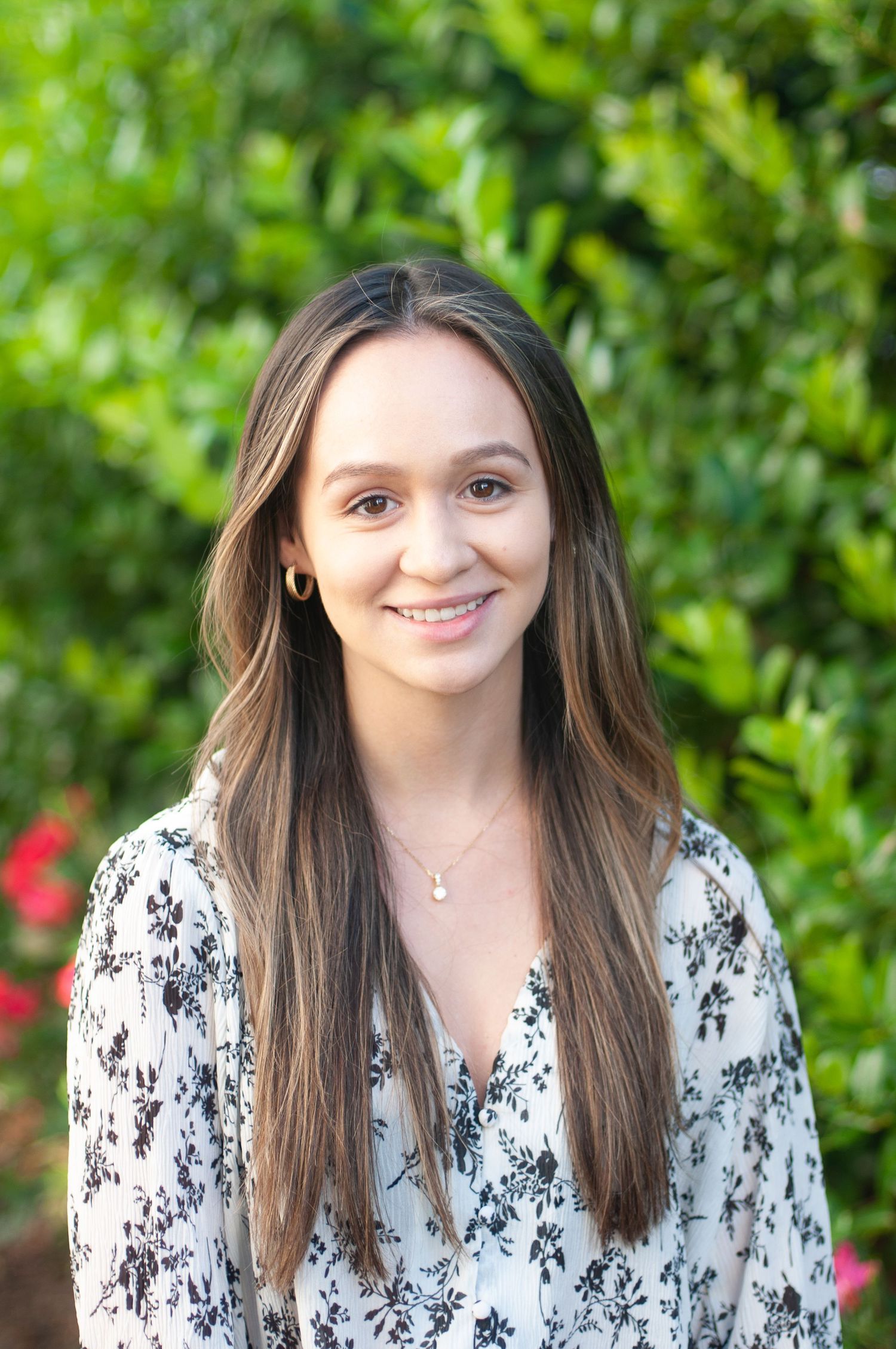 Headshot of a business professional woman in a clean bright setting to use on Linkedin and for networking or promotional materials