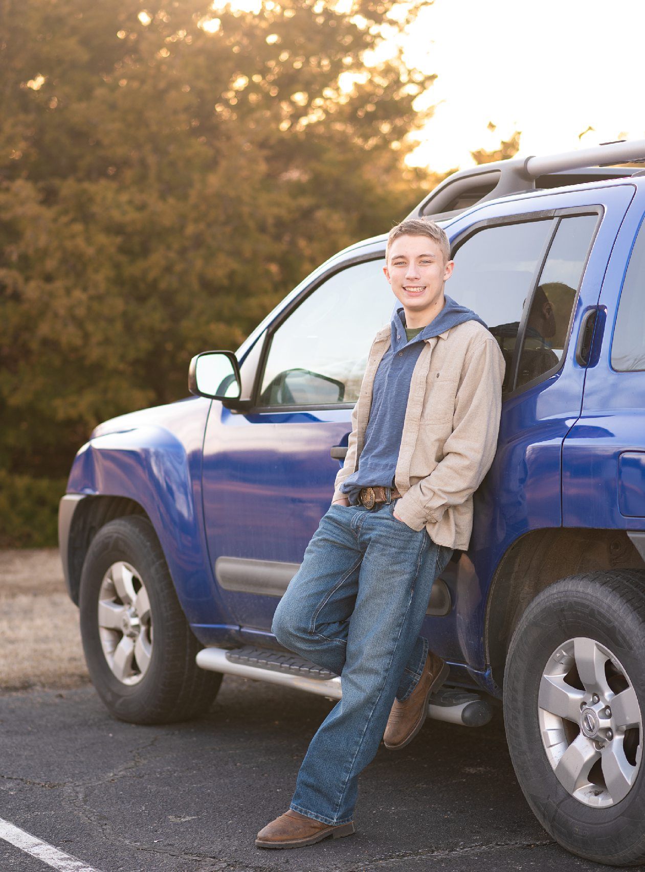 Senior guy portrait session in a late winter field and with his car by Kristi Bray Photography