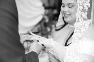 Joyful wedding couple sharing a champagne toast during their reception celebration.