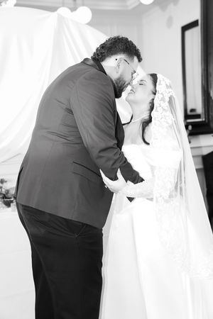 A series of black and white wedding photos showing intimate moments between a couple in formal attire.