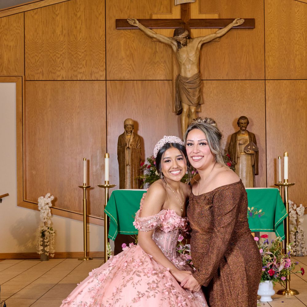 Quinceañera celebration photo in church with decorative pink dress and religious backdrop.