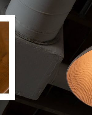 Abstract architectural detail showing white walls and a tan curved element.